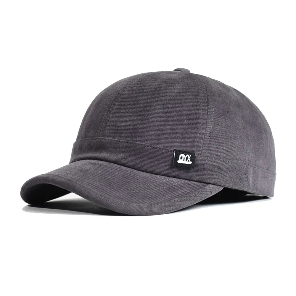 Vintage baseballkasket med kort skygge i bomuld til mænd og kvinder – blød »dad hat« i justerbar trucker-stil med lav profil